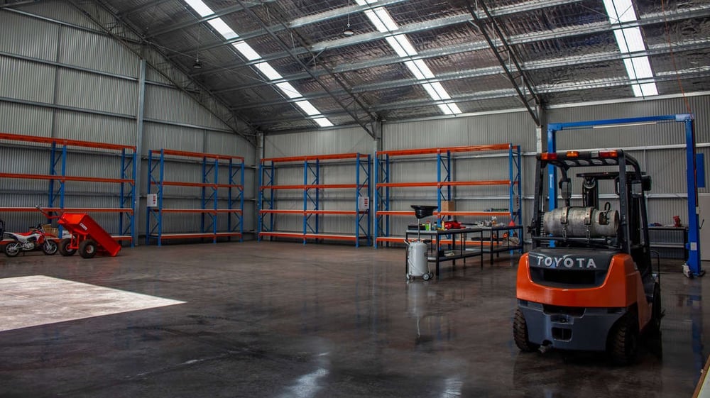 Workshop shed with storage shelves