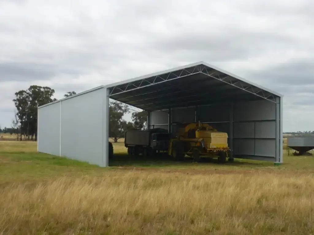 open ended durakit kit shed on farm with machinery