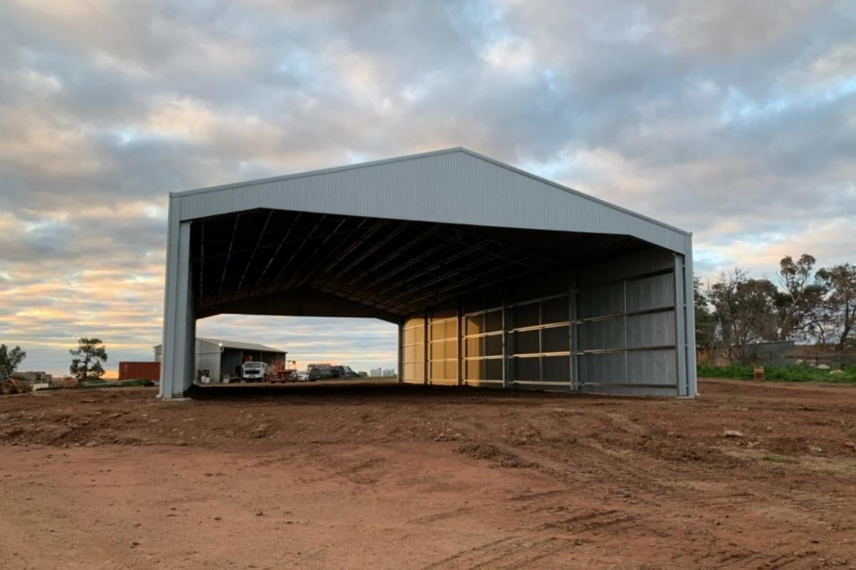 Drive-through machinery shed with gable infills