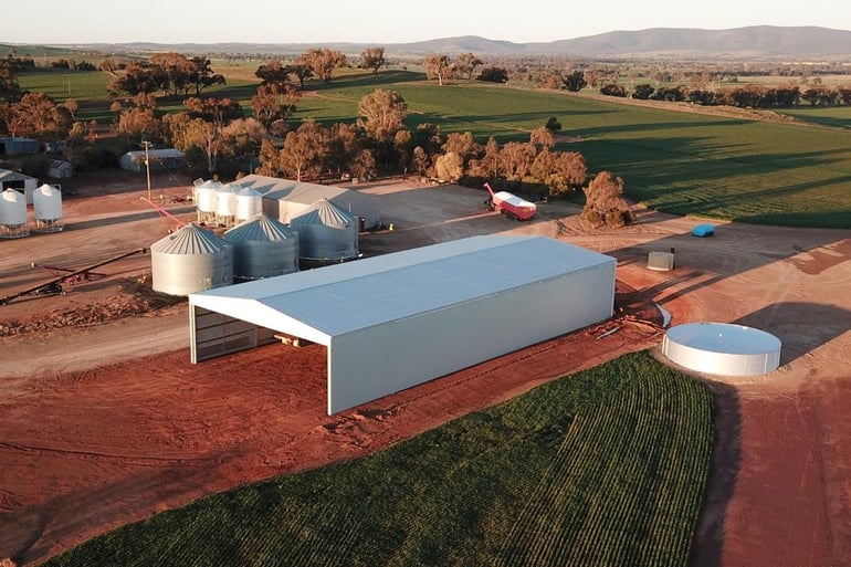 Wide span drive-through shed