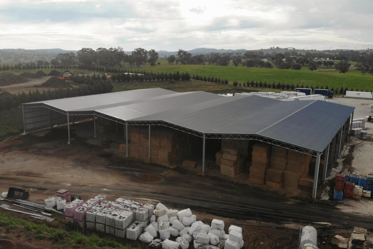 Drive-through machinery shed with M roof