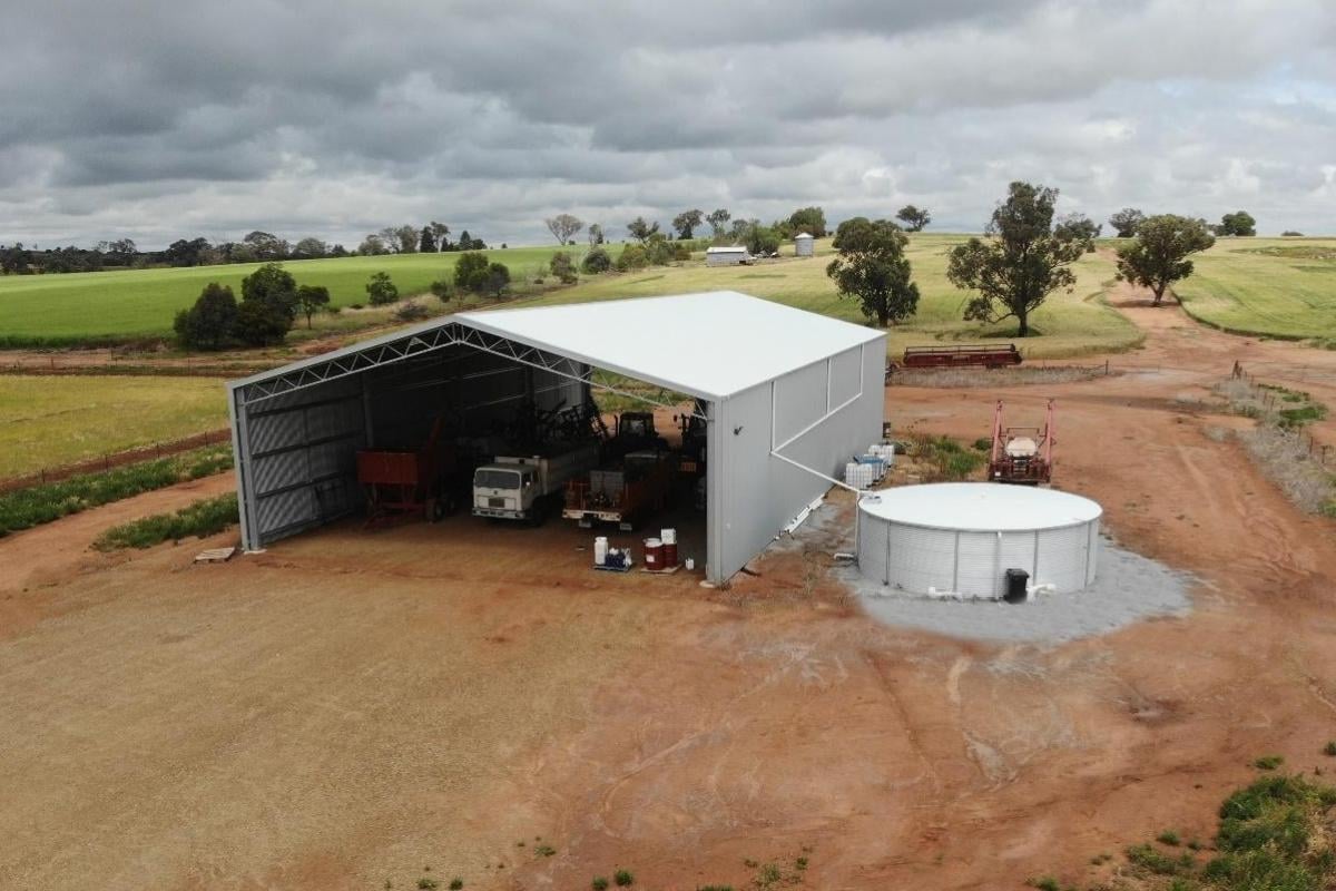 Drive-through machinery shed with increased height