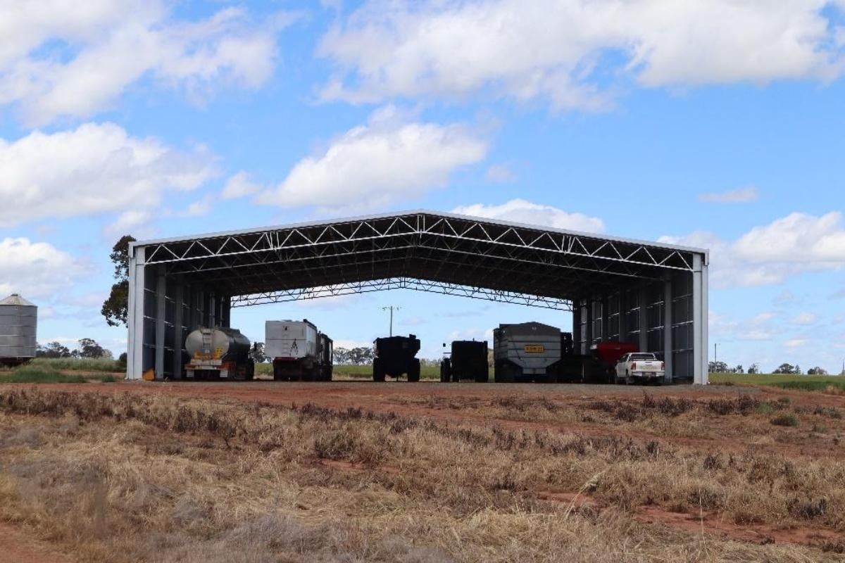 Vehicles parked in drive-through machinery shed