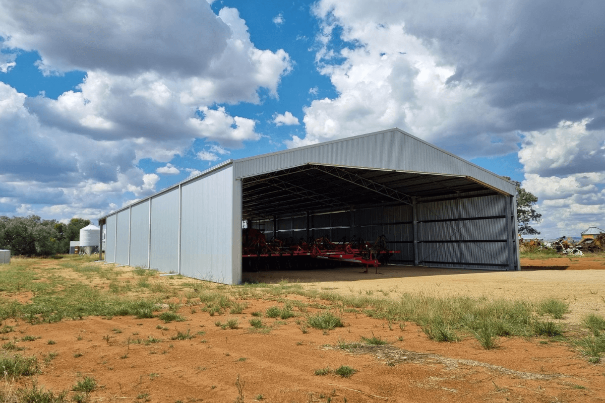 Side view of drive-through machinery shed in Thuddungra