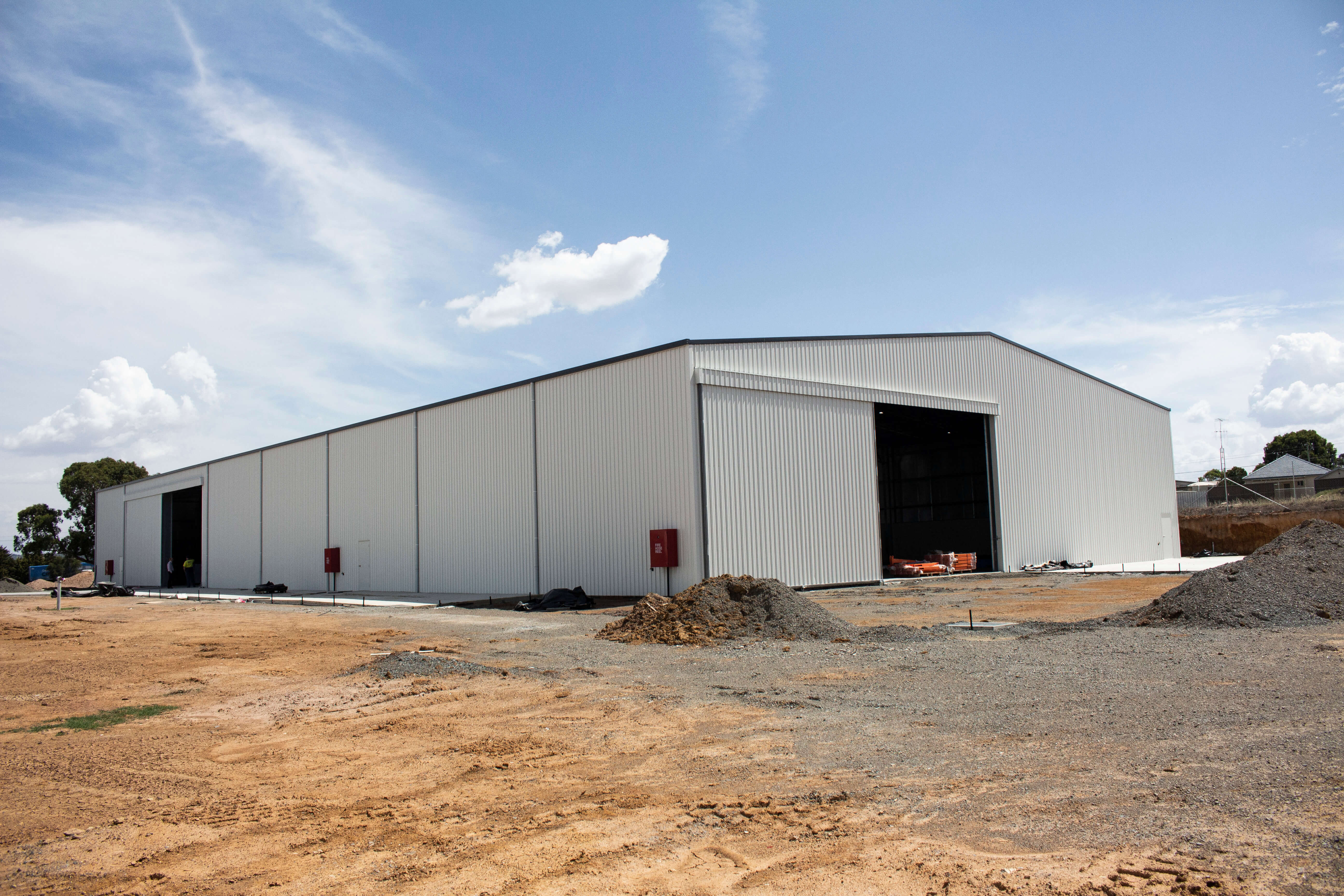 Structural steel industrial shed with sliding door