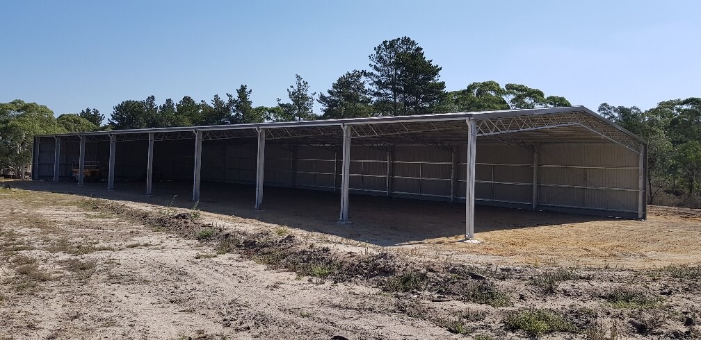 Covered dressage arena with eight bays